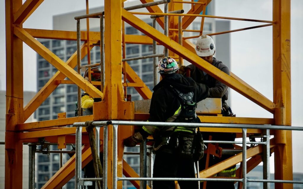 a construction worker on a scaffolding platform.